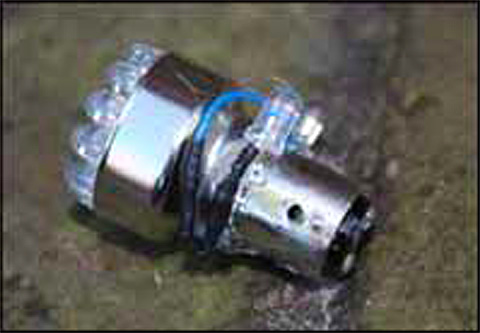 image 6 - Bulb showing white LEDs added to the side and the black spot where the extra pin had been. Small resisters are inside the black heat shrink tubing.